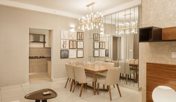 Prestige Park Street dining area render with a six-seater table set beside the open kitchen partition