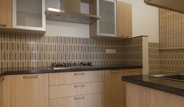 Prestige Park Street modular kitchen render showing the granite platform, chimney, hob and overhead cabinetry